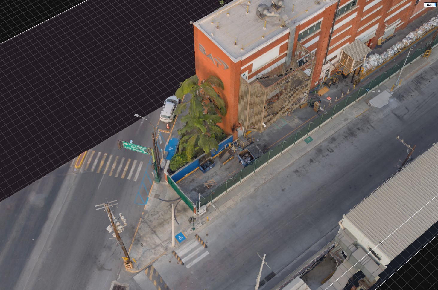 Reconstrucción 3D de edificio industrial vista aérea oblicua